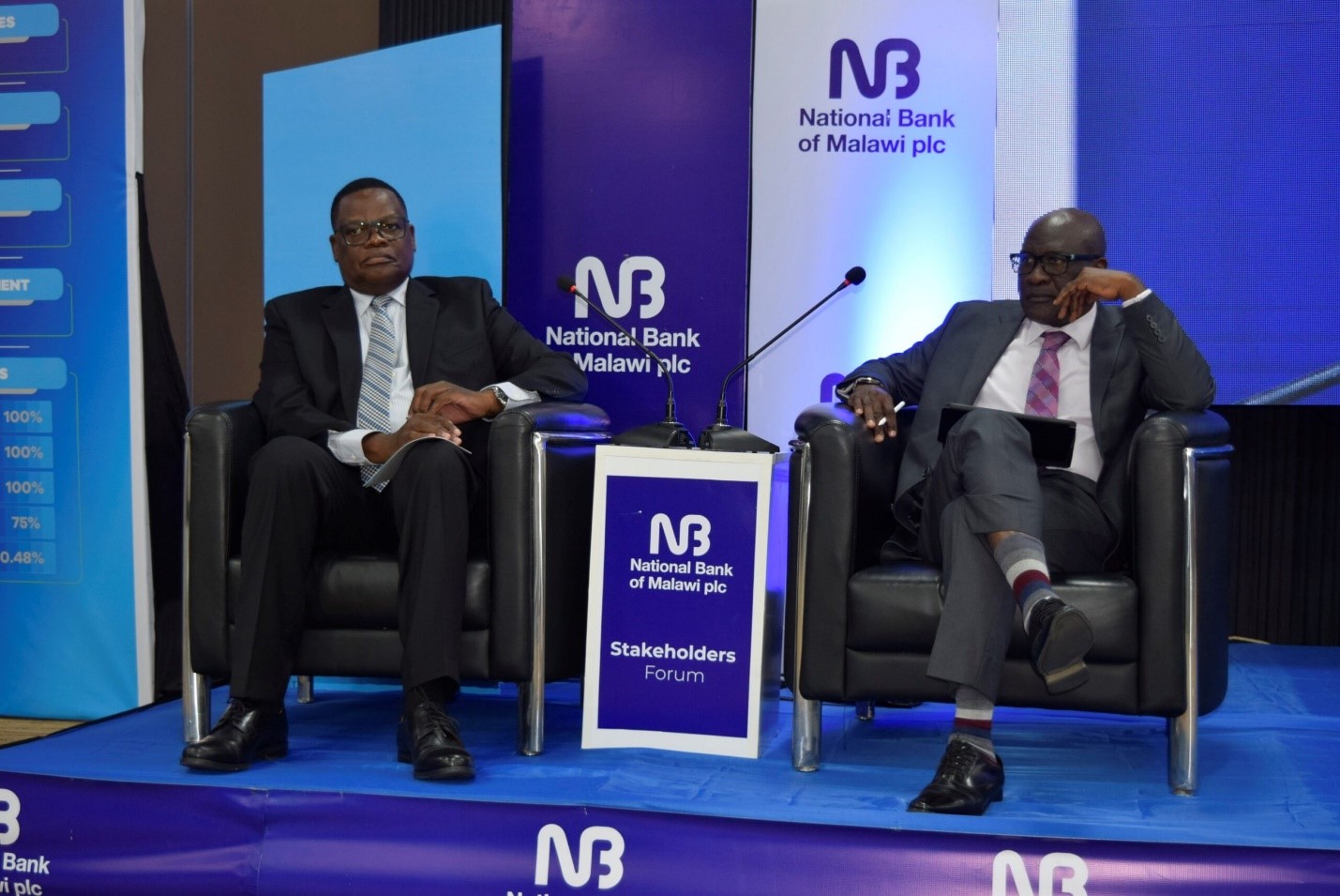 Board chair Lipunga (left) and CEO Kawawa listening attentively to the proceedings. 