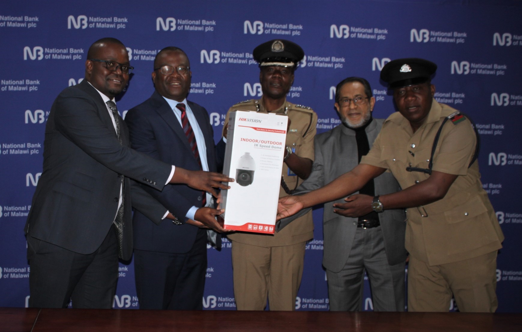 Blantyre Police Officer-in-Charge, Deputy Commissioner of Police Obrey Nyirenda (centre) receiving the symbiotic donation Blantyre Police Officer in Charge Deputy Commissioner of Police Obrey Nyirenda centre receiving the symbiotic donation