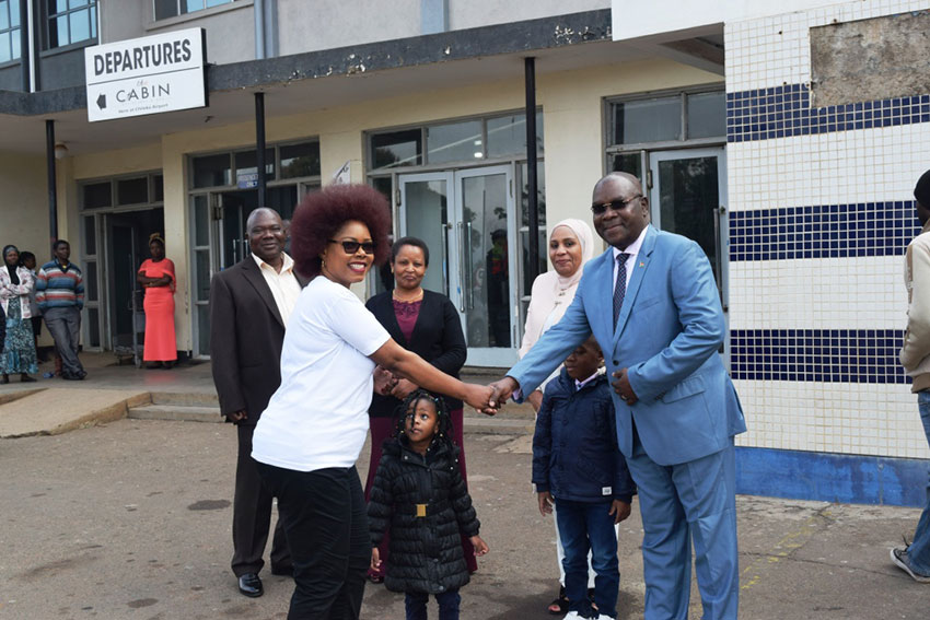Chibwana (left) bids farewell to Ambassador Ali as others look on