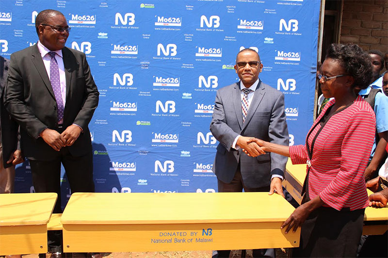 National Bank of Malawi donates desks to Njewa Community Day Secondary