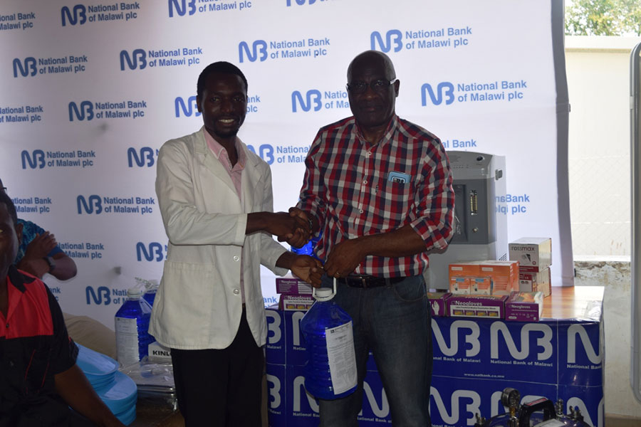 Kawawa right presents to Dwambazi Community Hospital In Charge Samuel Mwamutowe
