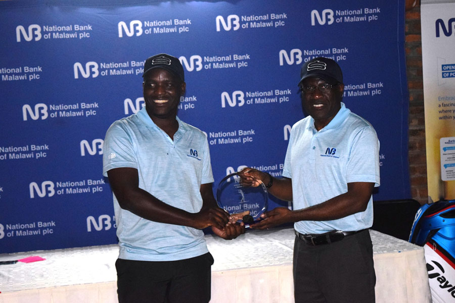 Kawawa (right) presents the winning medal to Nthakomwa Kawawaright presents the winning medal to Nthakomwa