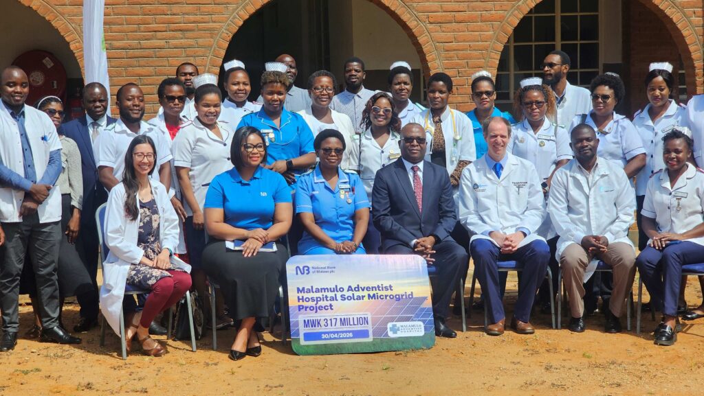Malamulo hospital staff poses for a picture with National Bank plc staff after at the MoU signing event
