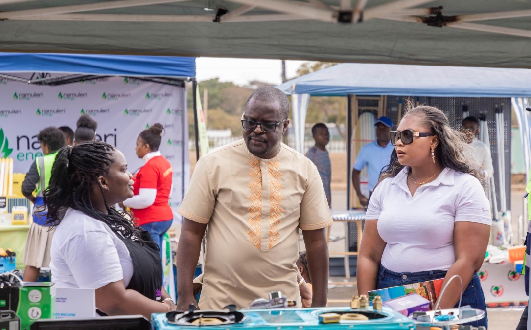 Mumba (middle) and Hiwa (right) visiting an SME at the exhibition ground Mumba middle and Hiwa right visiting an SME at the exhibition ground
