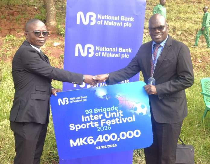 Singano (right) handing over the symbolic cheque to Kondowe