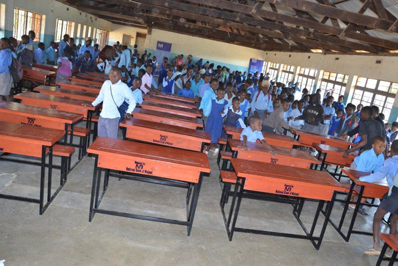 Donation of desks and chairs to Ntejera Community Day Secondary and Limbe Primary Schools
