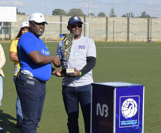Jere (right) and Haiya Holding the NBM Women's Premiership at the Launch kickoff