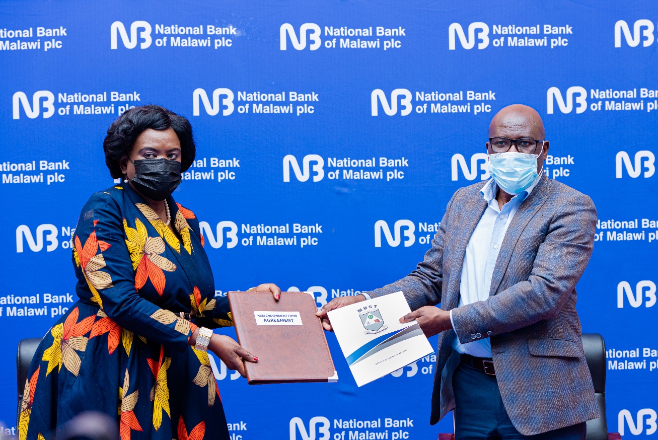 Mr Macfussy Kawawa, NBM plc CEO (L) and Prof. Address Malata, Vice Chancellor for MUST (R) during the agreement signing ceremony.
