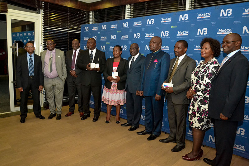 Malawi Ambassador to Kuwait and Mr Felix Maulidi will fly to Sun City in South Africa after winning in National Bank of Malawi (NBM) FiestaSave promotion.