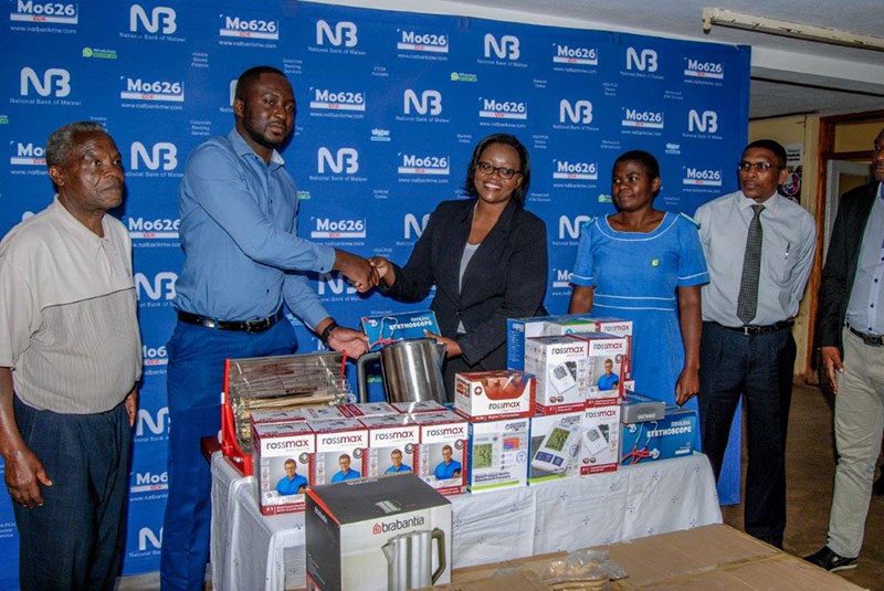Service Centre Manager for Mulanje service centre Ms Tamara Mtuwa hands over the equipment to the  District Health Officer Dr Khuliana Kabwere